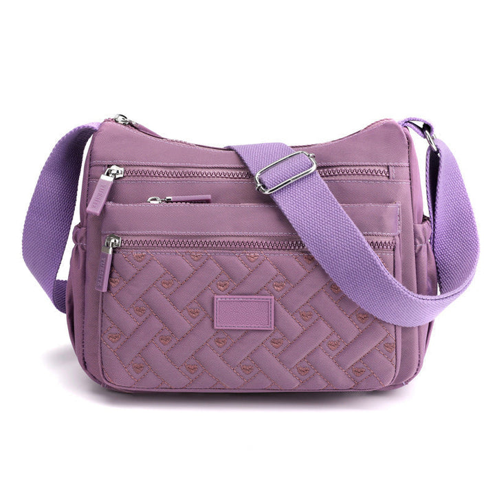 Elegant med funktionalitet med lyxig axelväska