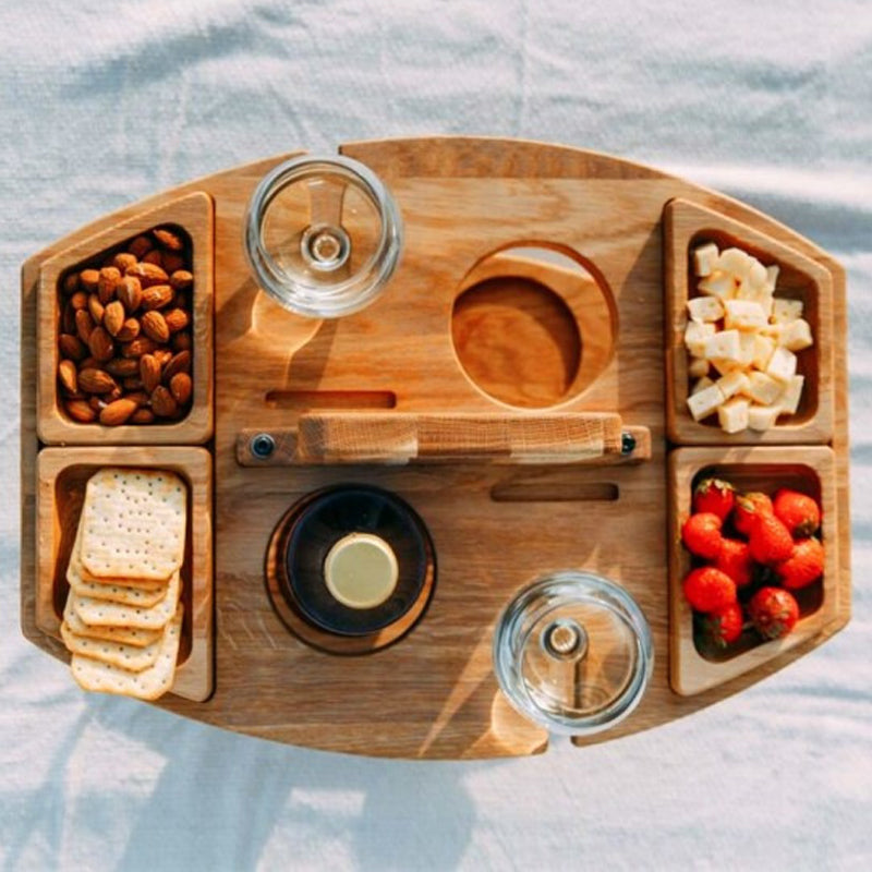 Kompakt picknickbord med flaskhållare i trä