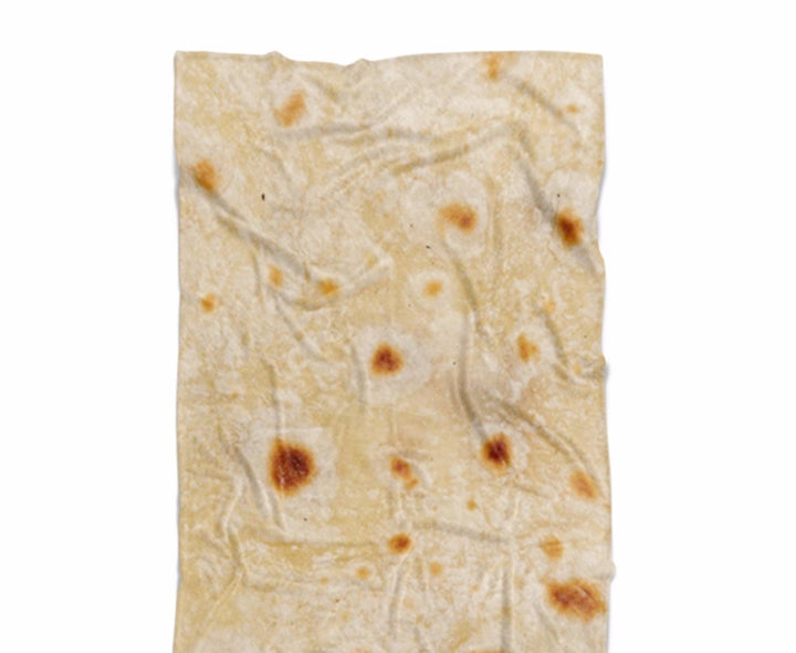 Rund tortillafilt på soffa