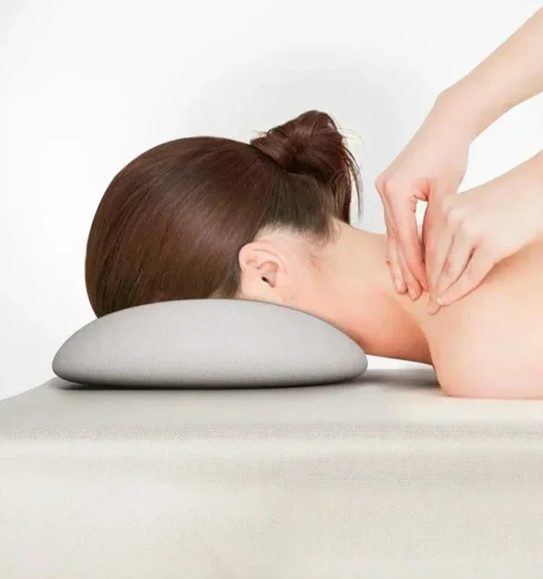 Ergonomiskt nackstöd för massagebänk