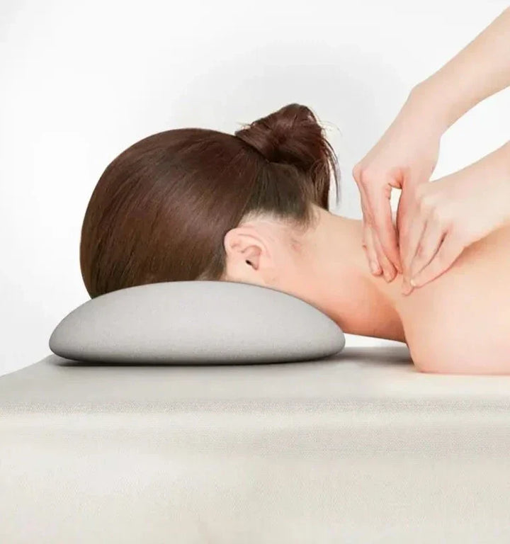Ergonomiskt nackstöd för massagebänk