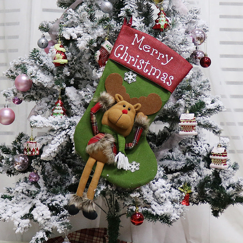 Julstrumpa med tomte och dinglande ben